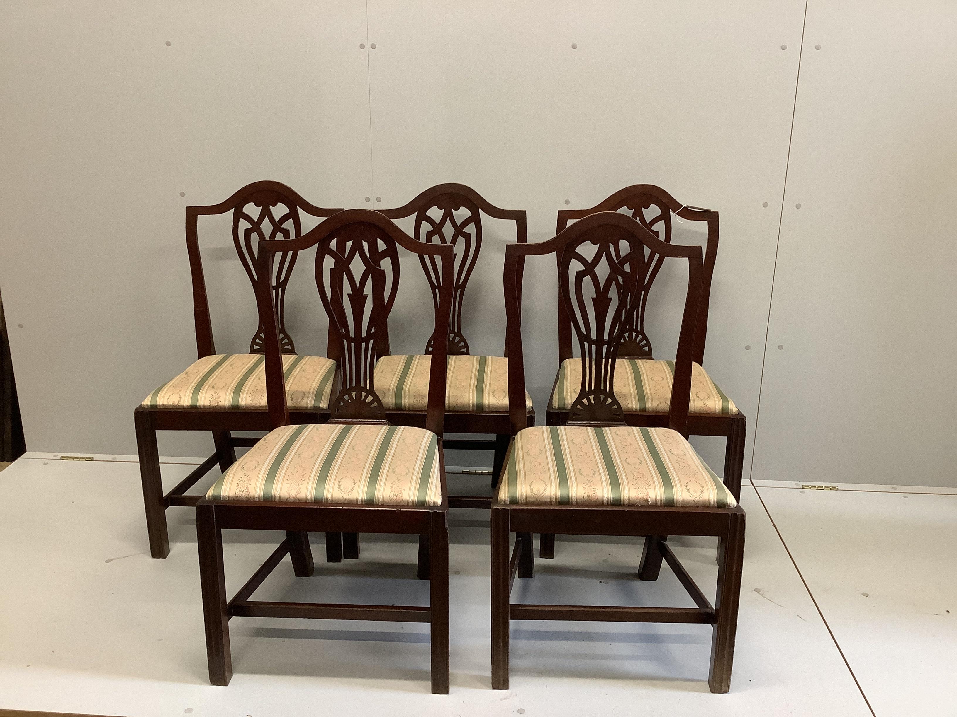 A set of five George III mahogany dining chairs